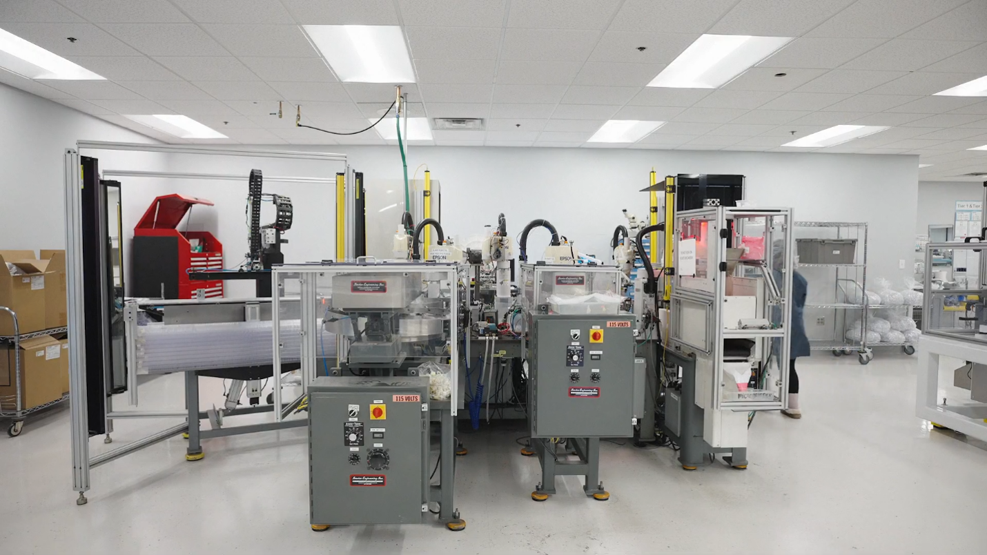 Automated assembly line with guarded production machinery
